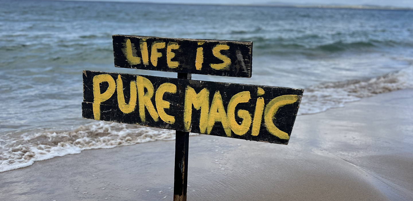 Pure Magic sign on the beach