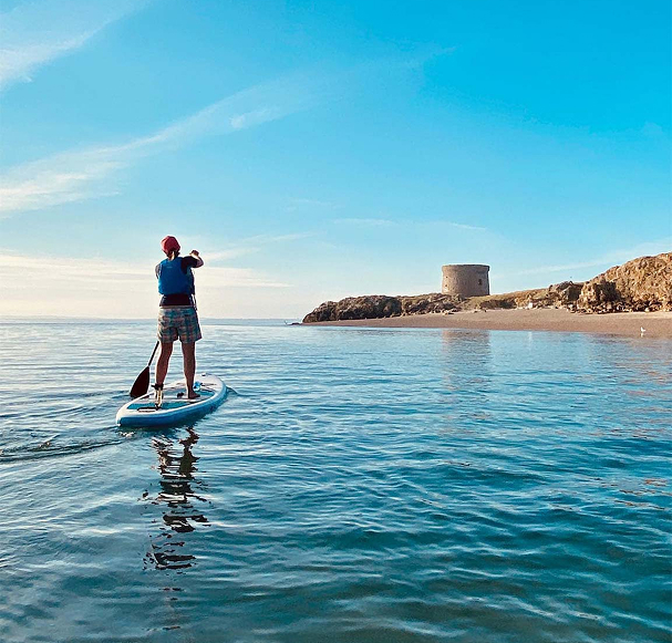 man doing sup in howth